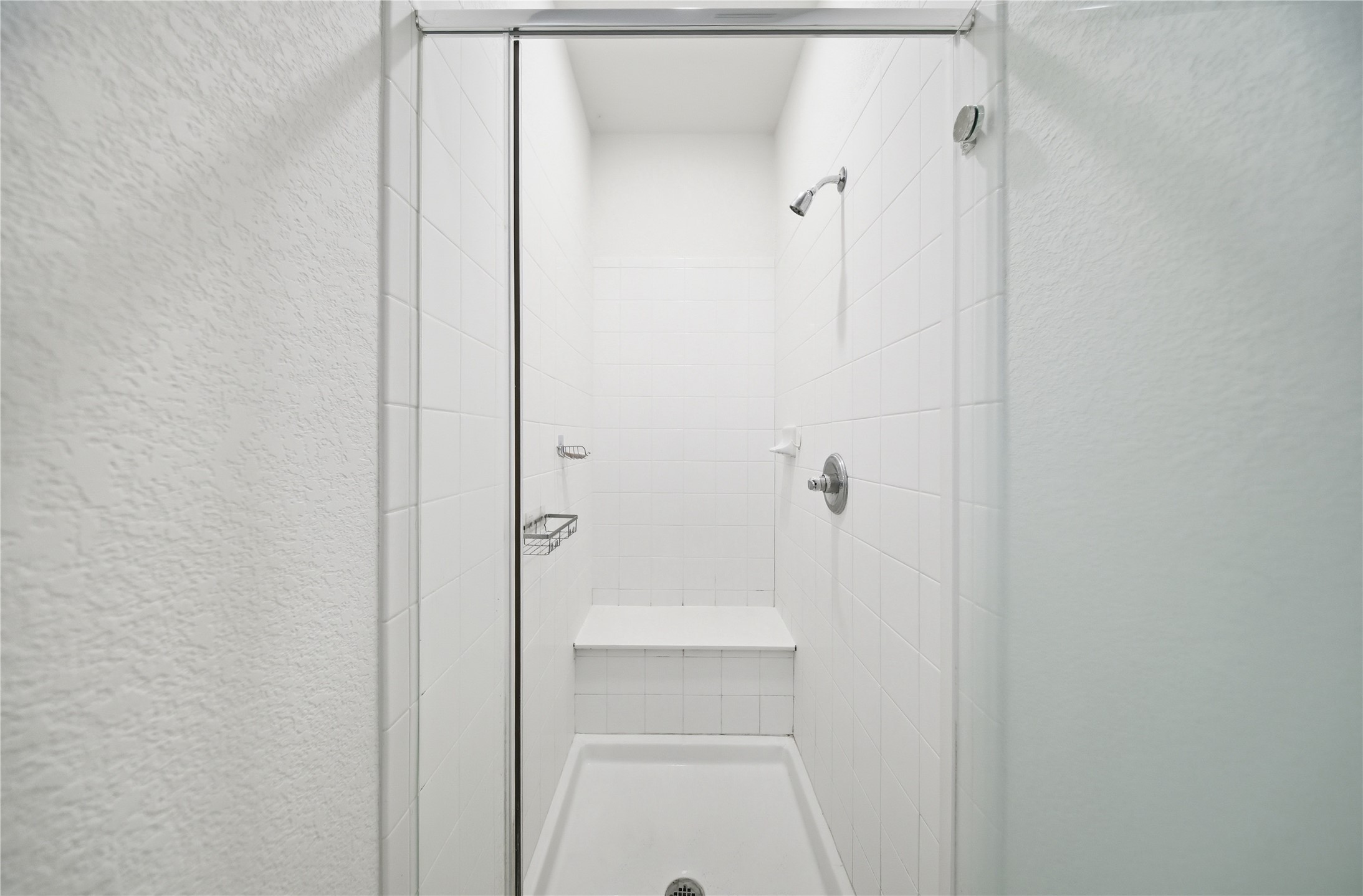 513 Warlander Way Georgetown, TX 78626 - Photo 20 of 35 a bathroom with a glass shower door