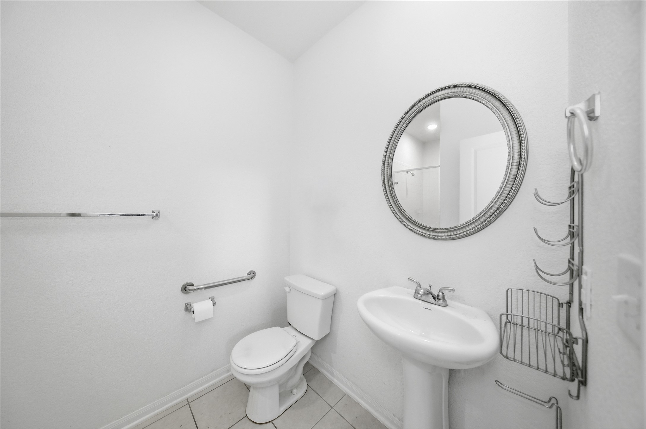 513 Warlander Way Georgetown, TX 78626 - Photo 25 of 35 a bathroom with a sink a mirror and a toilet