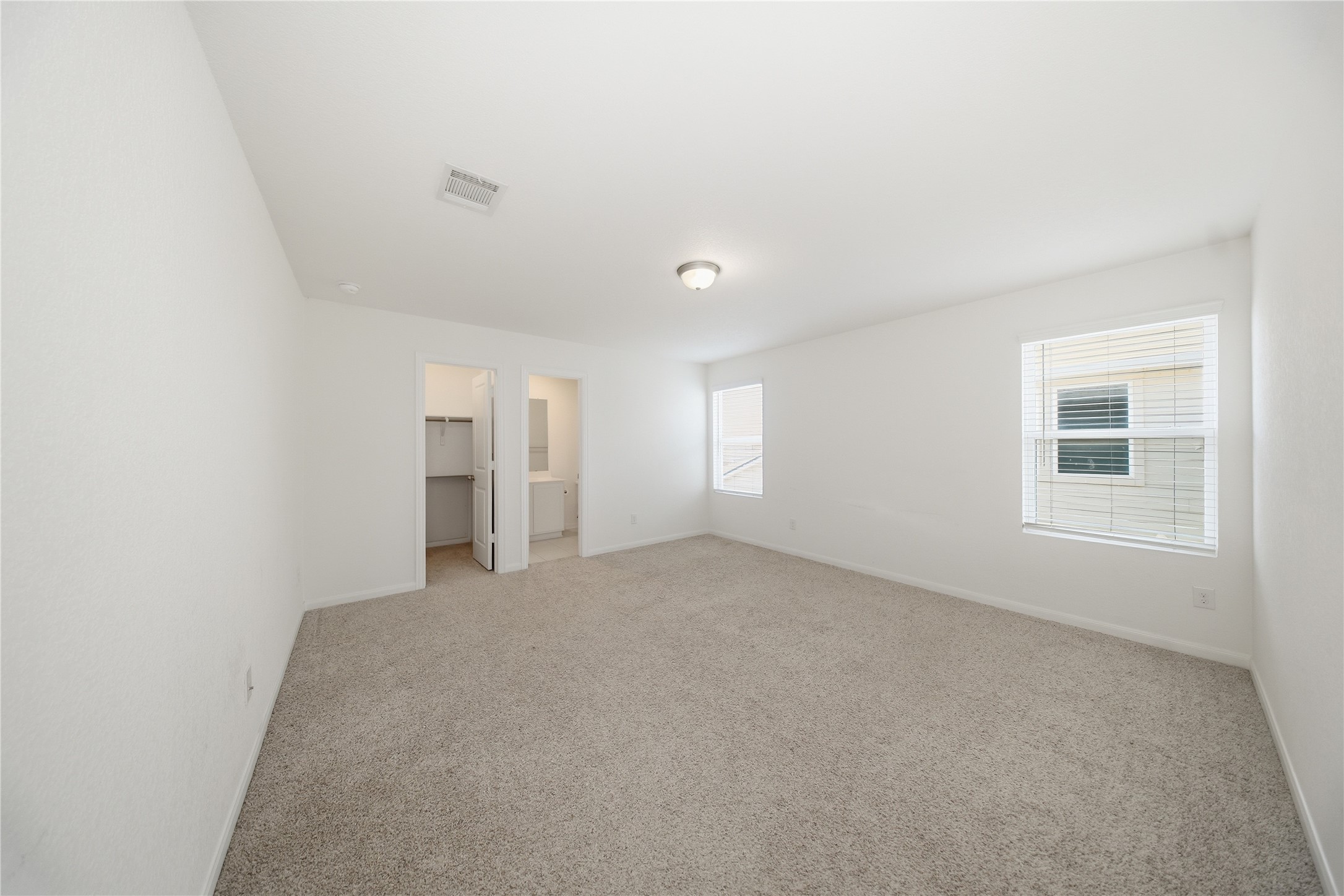 513 Warlander Way Georgetown, TX 78626 - Photo 28 of 35 a view of empty room with windows