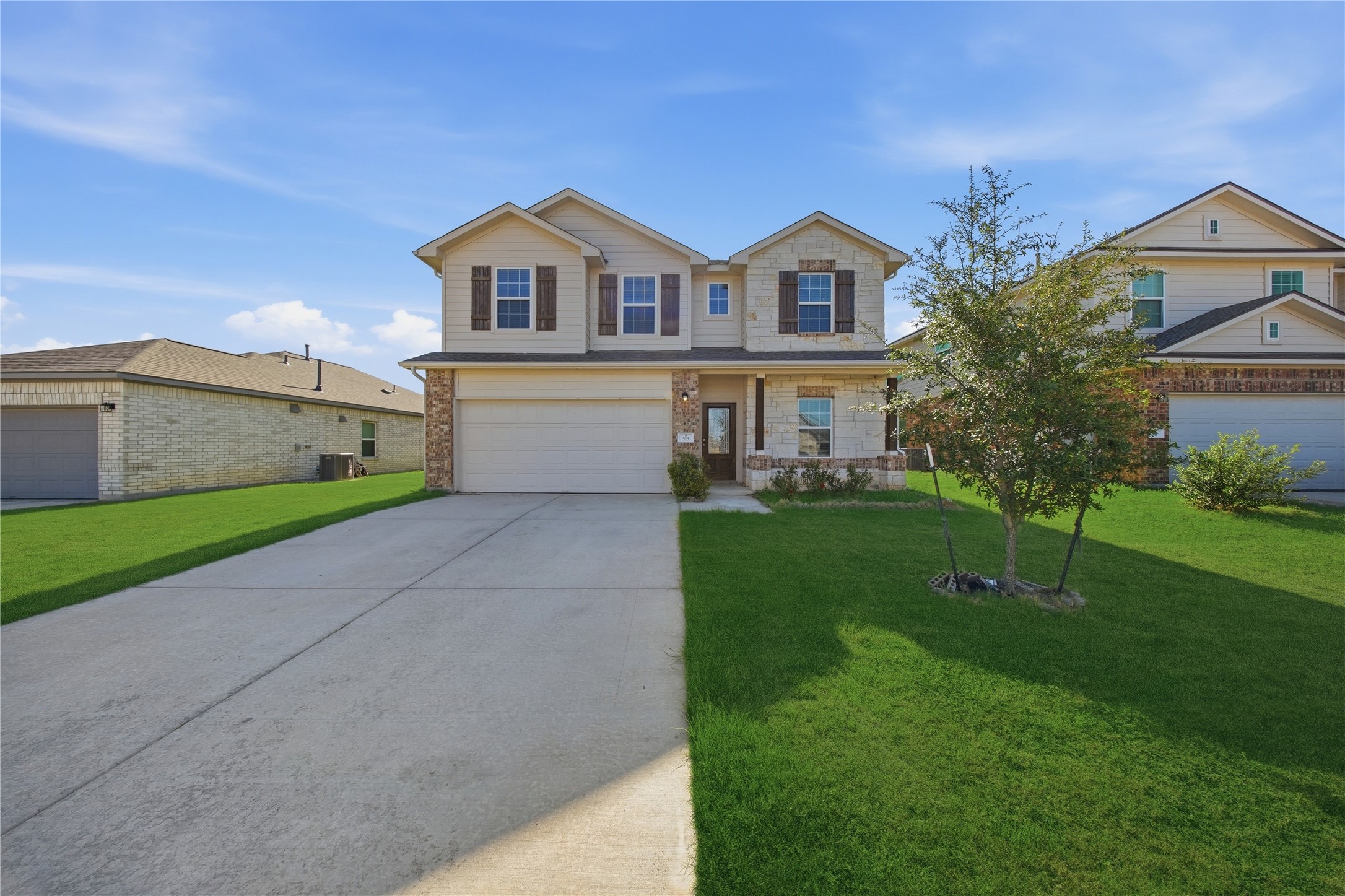 513 Warlander Way Georgetown, TX 78626 - Photo 32 of 35 a front view of a house with a yard and garage