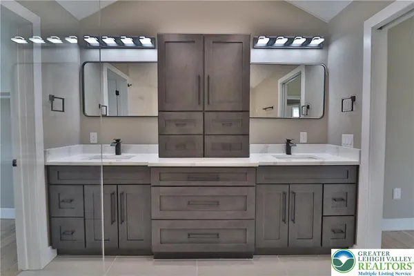 a kitchen with a sink and cabinets