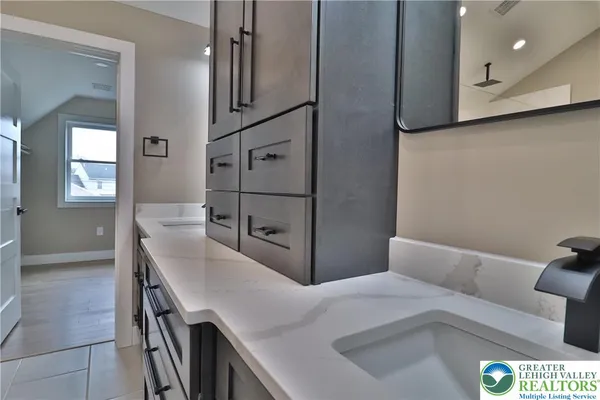 a bathroom with a sink a toilet and a bathtub