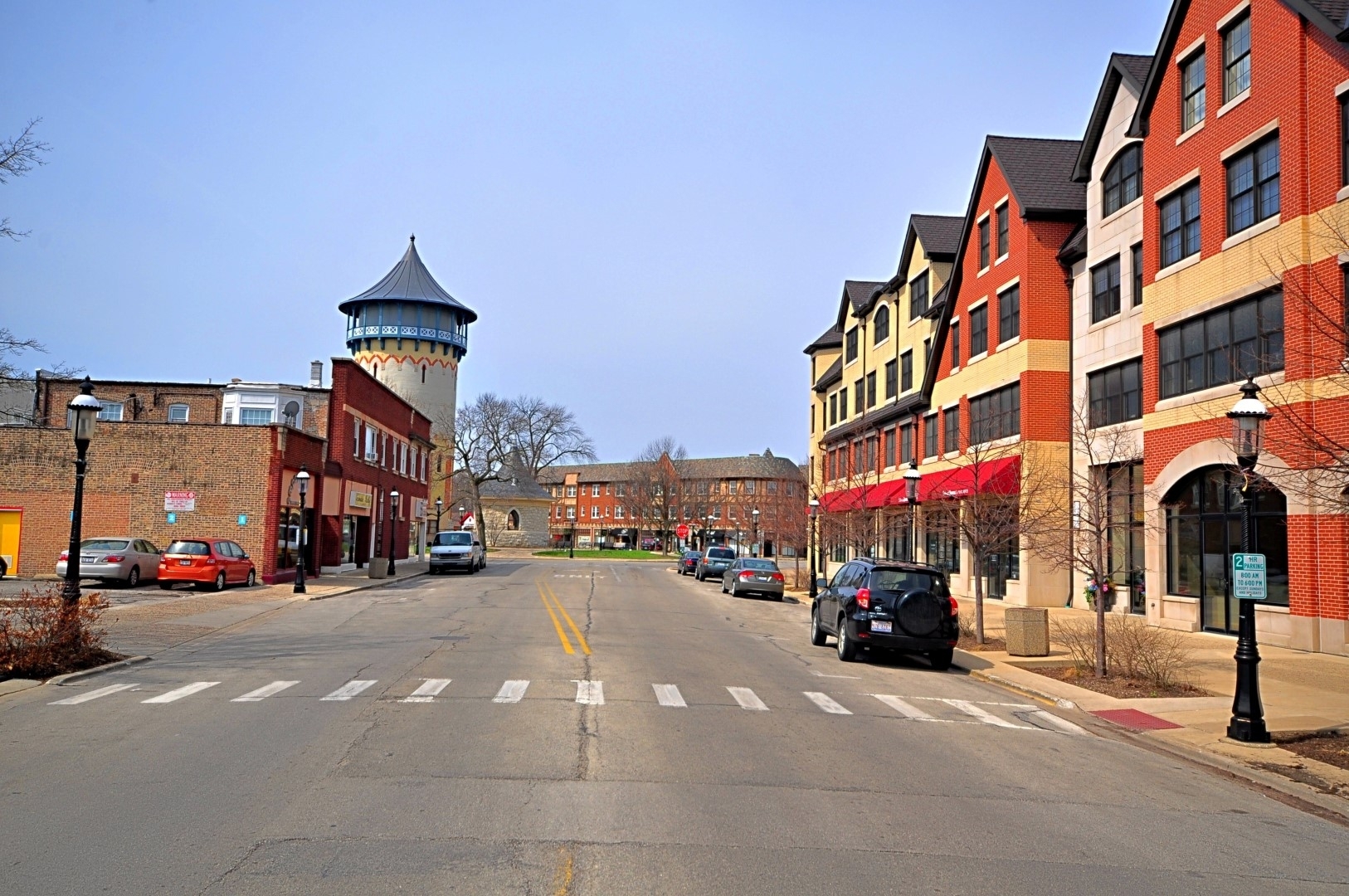 65 Longcommon Road, Unit G Riverside, IL 60546 - Photo 17 of 19 a city street lined with buildings and cars