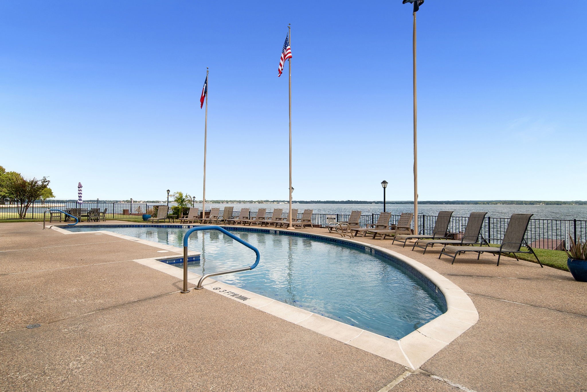 801 River Road, Unit E 116 Montgomery, TX 77356 - Photo 12 of 14 Community exclusive pool looking out to the lake.