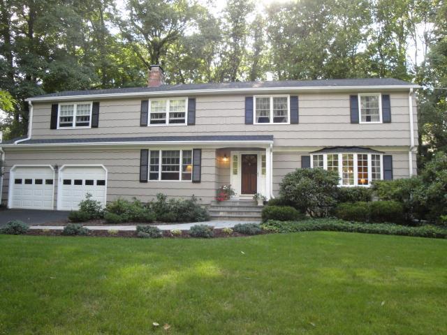 27 Salem Road Trumbull, CT 06611 - Photo 1 of 1 a front view of a house with a garden and yard