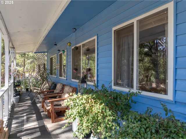 a view of backyard with porch and outdoor seating