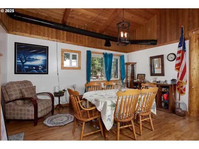 a dining room with furniture and window