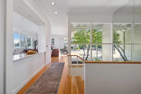 a view of a living room and dining room