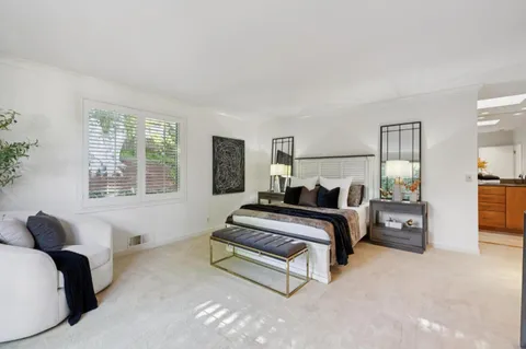 a bed room with furniture and a window