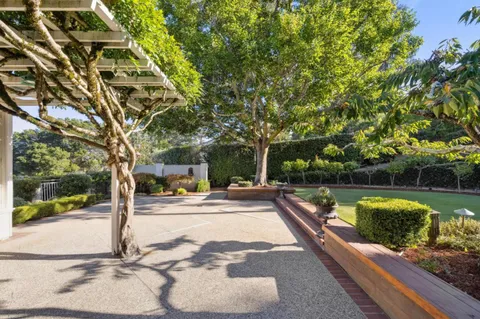 a view of a swimming pool with a patio