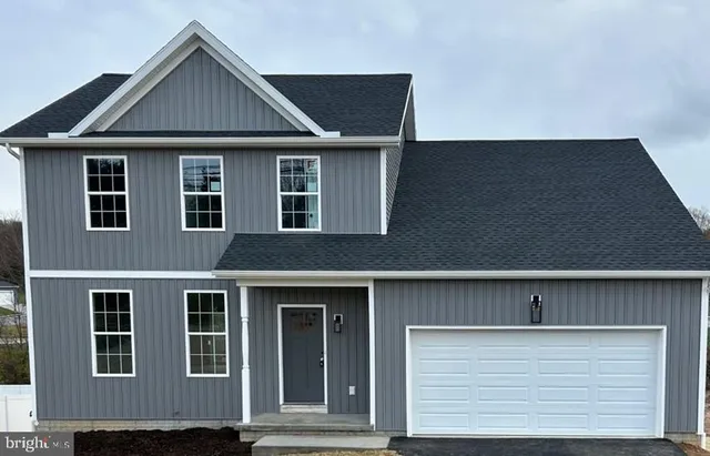a front view of a house with a garage