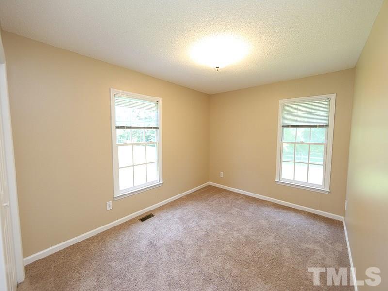 7408 Wiley Mangum Road Bahama, NC 27503 - Photo 11 of 13 an empty room with windows