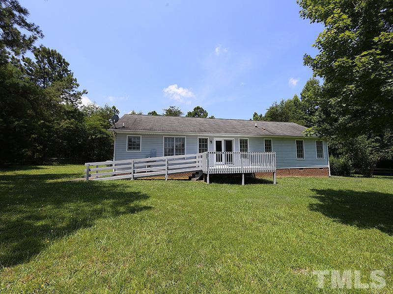 7408 Wiley Mangum Road Bahama, NC 27503 - Photo 13 of 13 a view of a house with a yard and sitting area