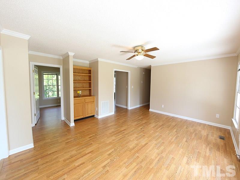 7408 Wiley Mangum Road Bahama, NC 27503 - Photo 4 of 13 a view of an empty room with window and wooden floor