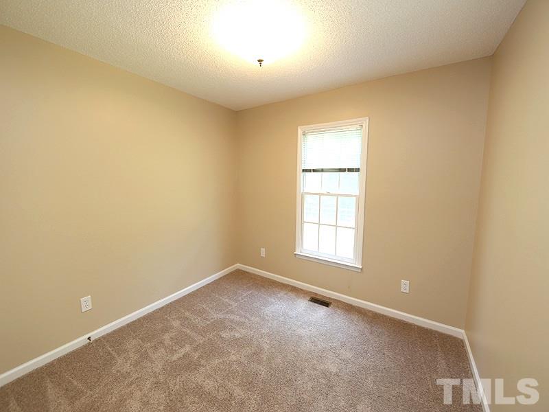 7408 Wiley Mangum Road Bahama, NC 27503 - Photo 10 of 13 an empty room with a window
