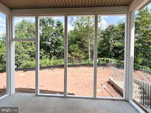 9285 Crestview Rdg Drive Bristow, VA 20136 - Photo 11 of 25 a view of a room with wooden floor and floor to ceiling window