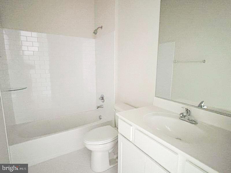 9285 Crestview Rdg Drive Bristow, VA 20136 - Photo 15 of 25 a bathroom with a sink a toilet and shower