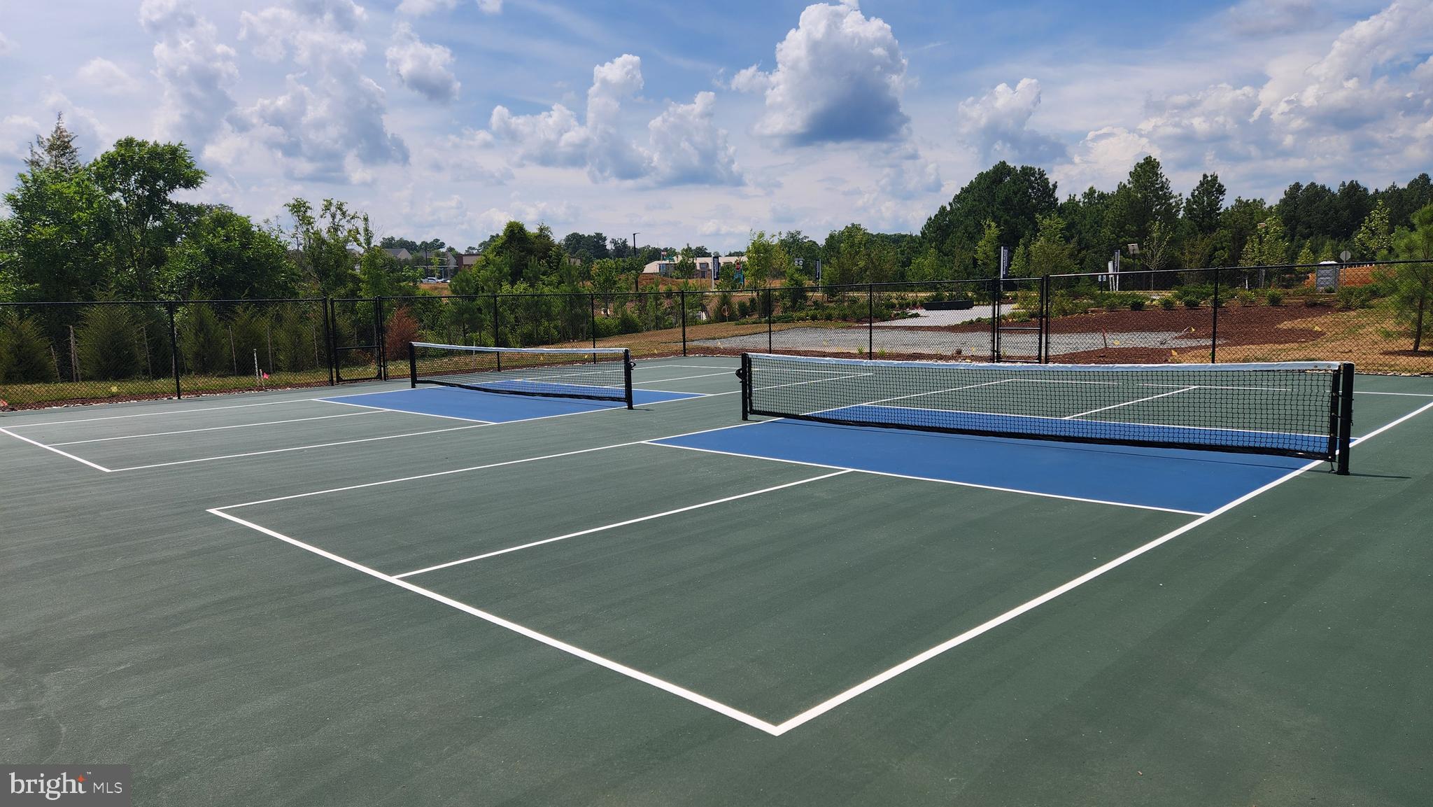9285 Crestview Rdg Drive Bristow, VA 20136 - Photo 25 of 25 a view of tennis court with houses