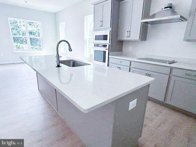 9285 Crestview Rdg Drive Bristow, VA 20136 - Photo 5 of 25 a kitchen with kitchen island a sink appliances and a counter top