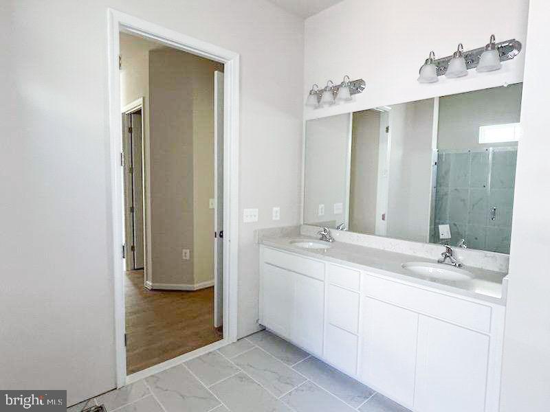9285 Crestview Rdg Drive Bristow, VA 20136 - Photo 7 of 25 a bathroom with a sink and a mirror