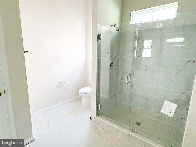 9285 Crestview Rdg Drive Bristow, VA 20136 - Photo 8 of 25 a bathroom with a shower and a toilet