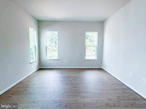 9285 Crestview Rdg Drive Bristow, VA 20136 - Photo 9 of 25 an empty room with wooden floor and window