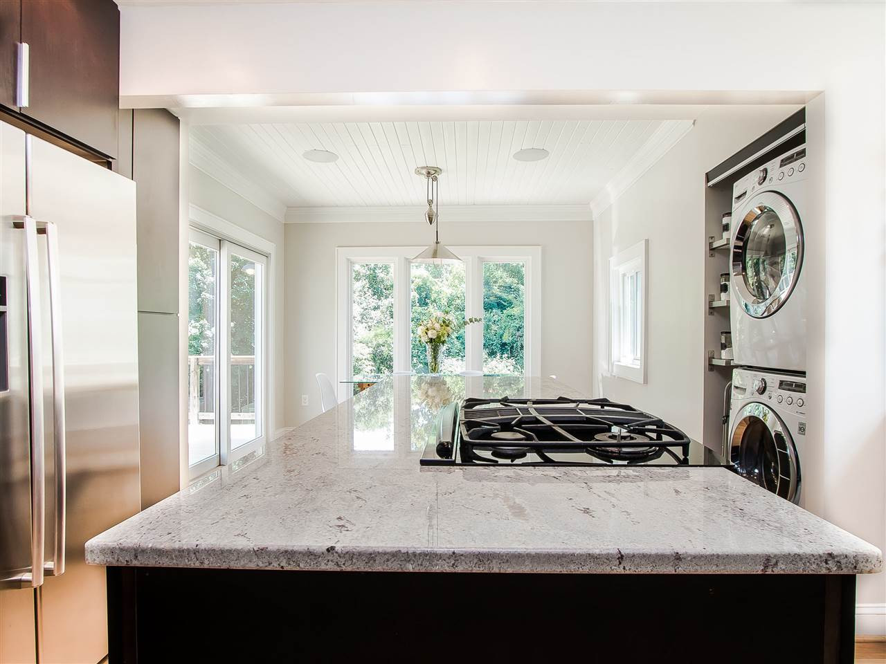 1634 Bickett Boulevard Raleigh, NC 27608 - Photo 13 of 25 The view from the kitchen through the dining room out to the backyard is breathtaking. Kitchen/Dining