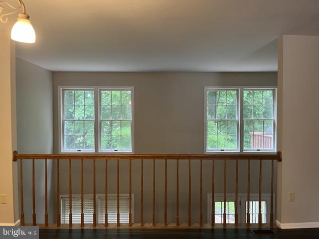 1049 Wingate Court, Unit I14 Bel Air, MD 21014 - Photo 13 of 61 a view of an empty room with wooden floor and a window