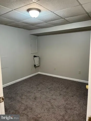 a view of a hallway with wooden door