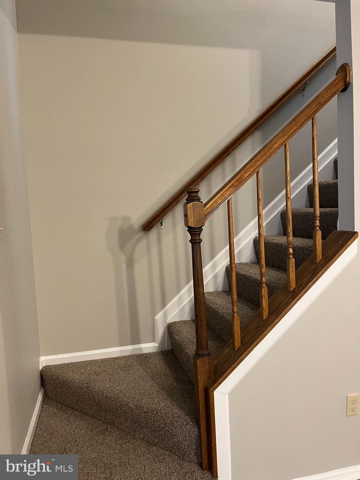 1049 Wingate Court, Unit I14 Bel Air, MD 21014 - Photo 35 of 61 a view of staircase with lots of frames on wall