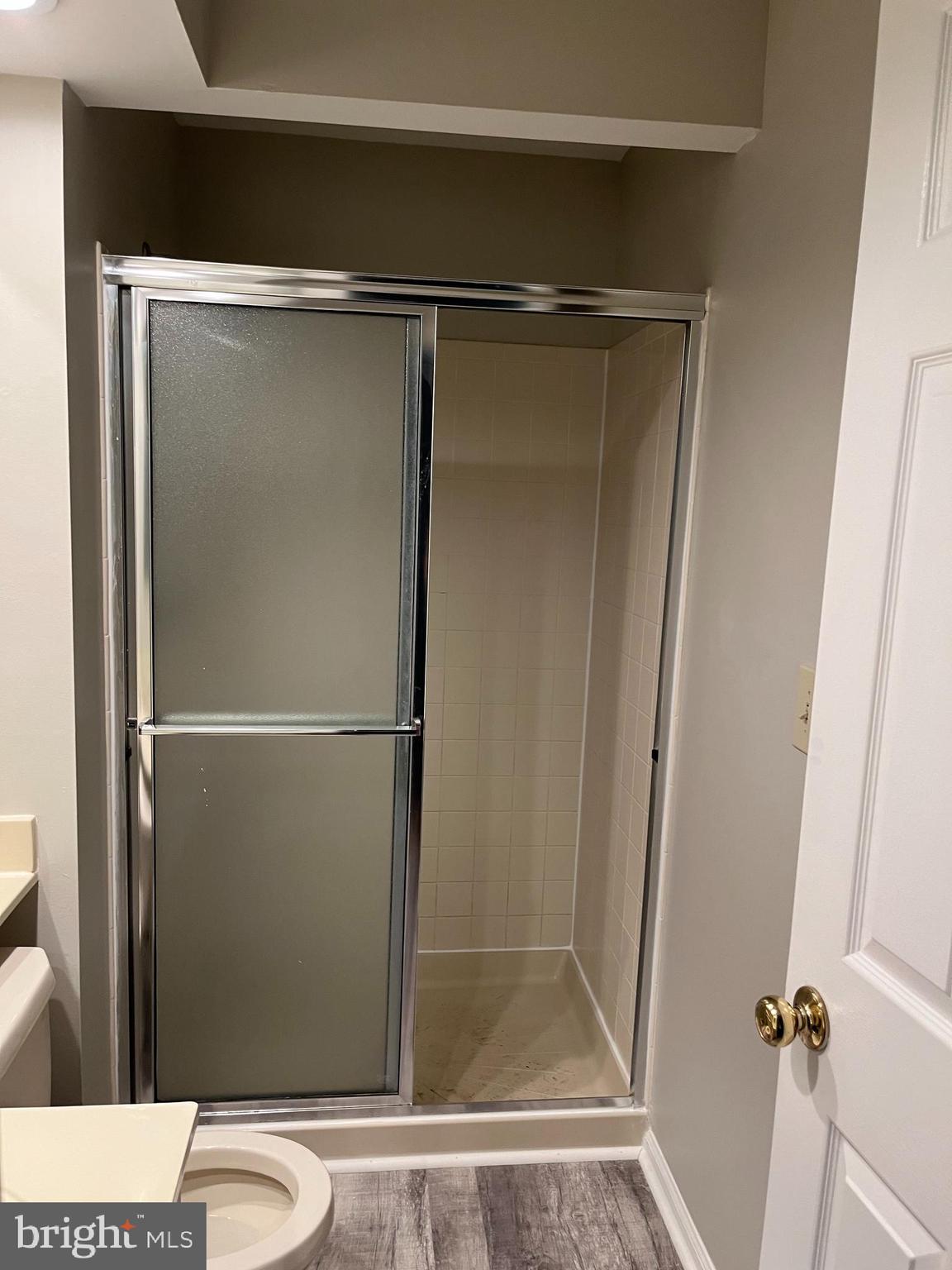 1049 Wingate Court, Unit I14 Bel Air, MD 21014 - Photo 56 of 61 a bathroom with a glass shower door