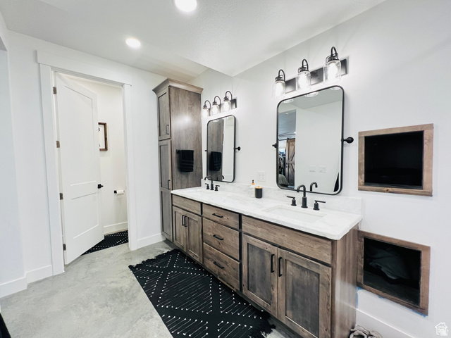 100 Whit Lane Georgetown, ID 83239 - Photo 34 of 76 Full bathroom with double vanity, concrete flooring, and recessed lighting