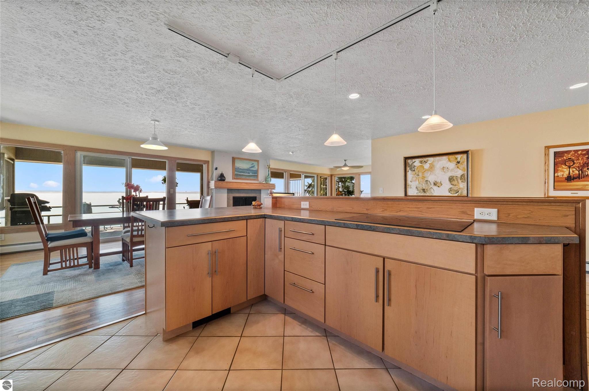 9428 Center Road Traverse City, MI 49686 - Photo 29 of 46 Great storage in this updated kitchen with constant views of the lake 365 days a year!