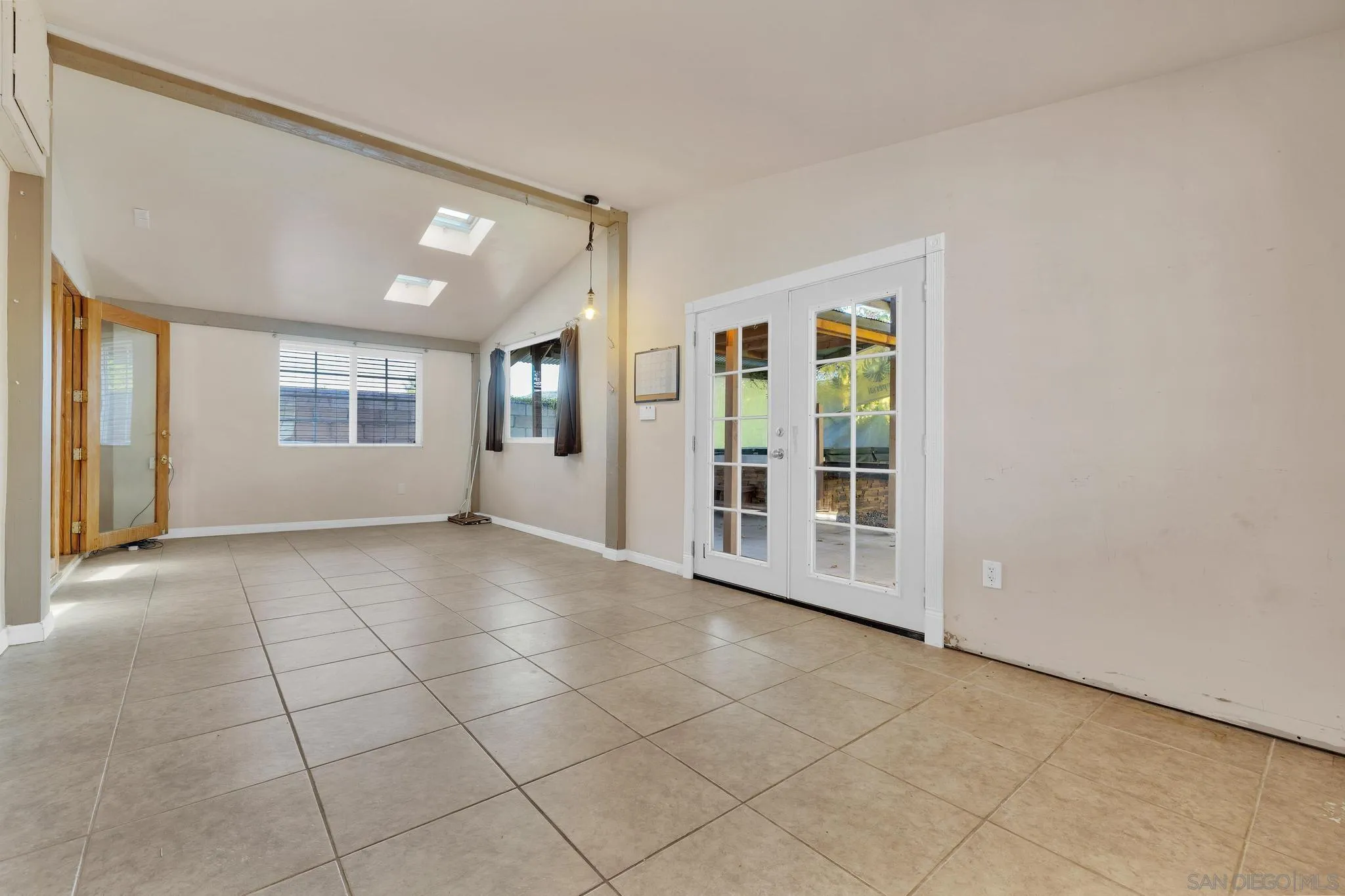 13938 Powers Road Poway, CA 92064 - Photo 28 of 34 a view of a big room with windows and chandelier fan