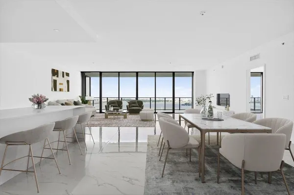 a view of a dining room with furniture and window