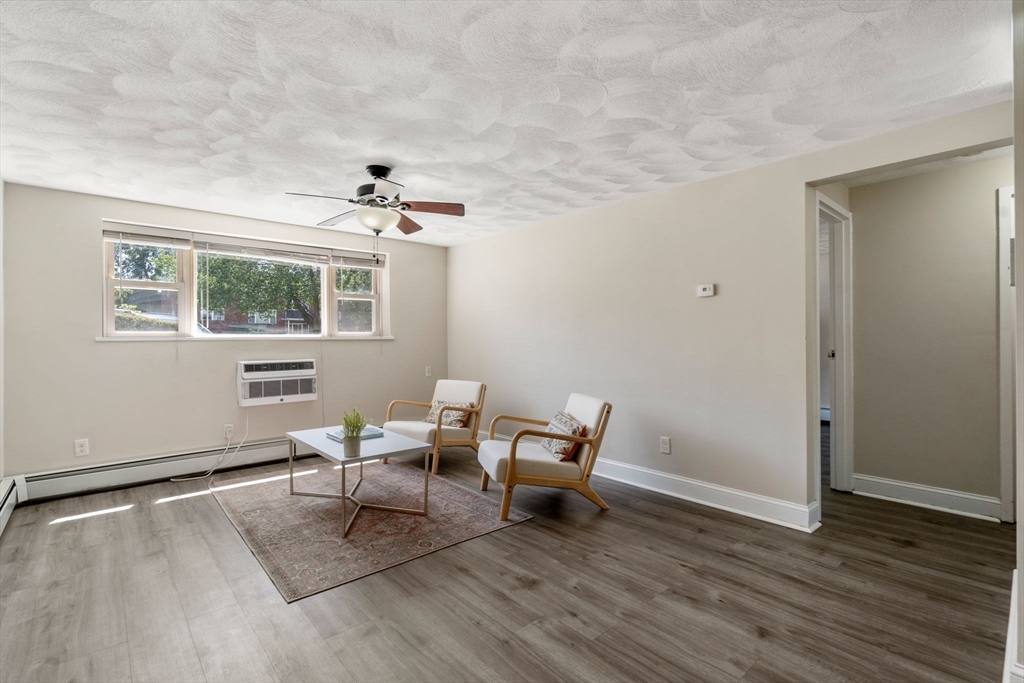 1105 Lexington Street, Unit 41 Waltham, MA 02452 - Photo 3 of 19 a living room with furniture and a window
