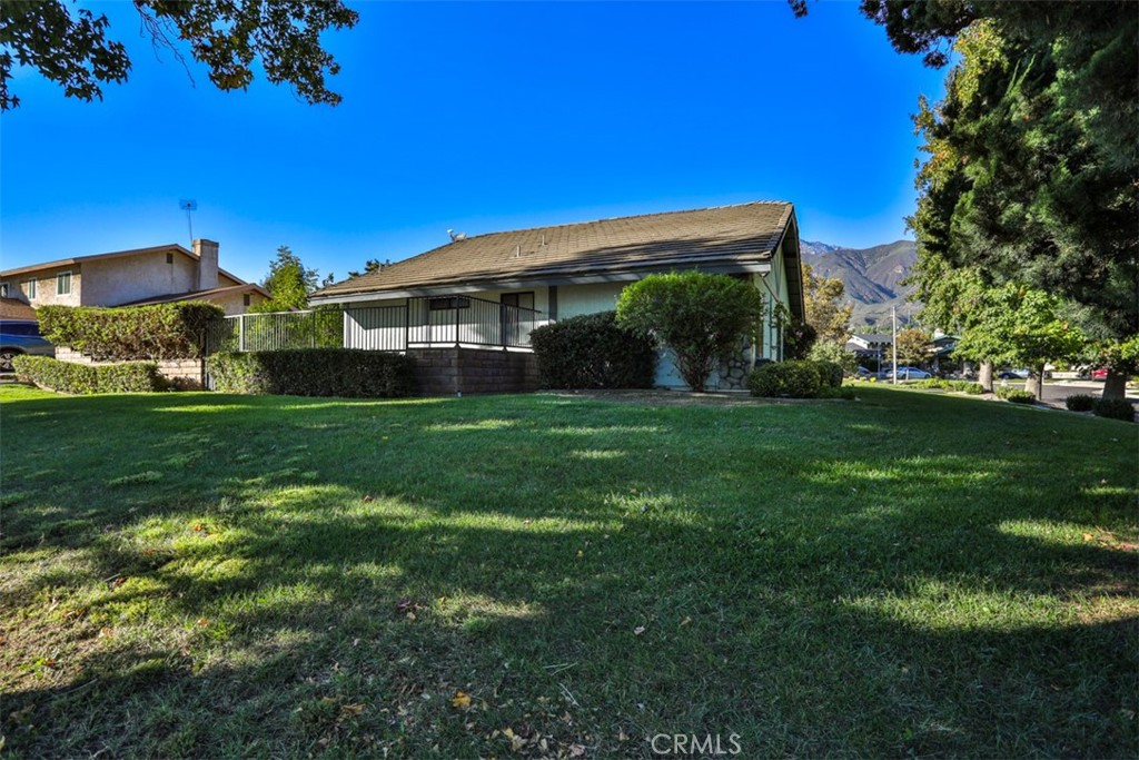 5848 Burlwood Court Rancho Cucamonga, CA 91701 - Photo 11 of 71 a view of a house with a yard