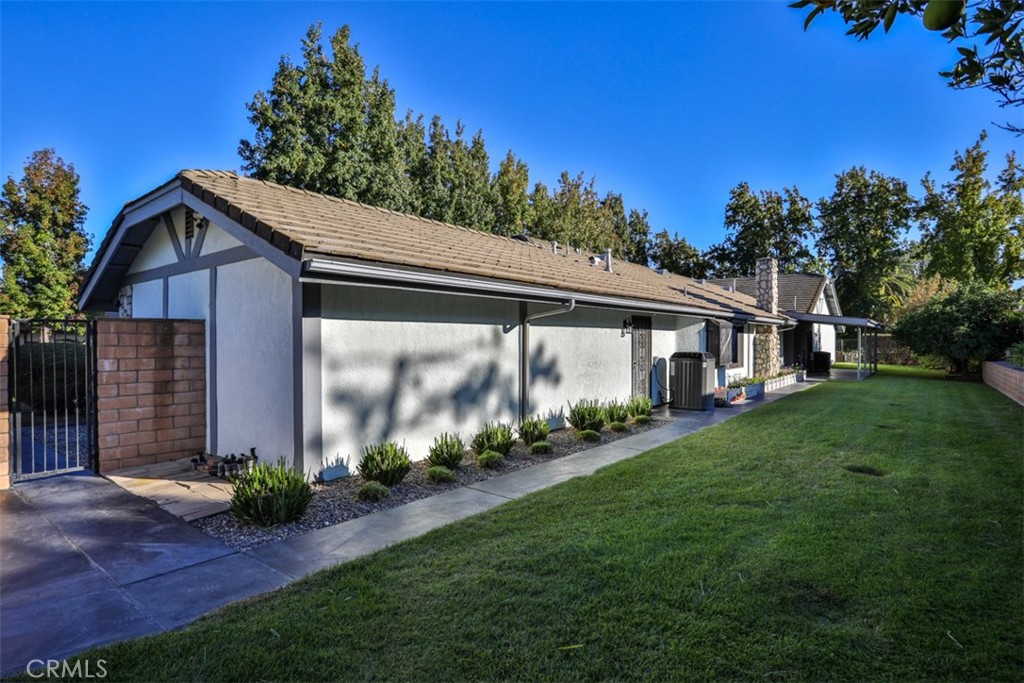 5848 Burlwood Court Rancho Cucamonga, CA 91701 - Photo 21 of 71 a front view of a house with a yard
