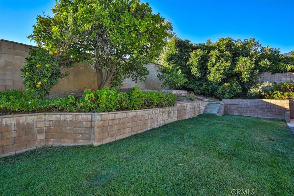 5848 Burlwood Court Rancho Cucamonga, CA 91701 - Photo 23 of 71 a view of yard with swimming pool and green space