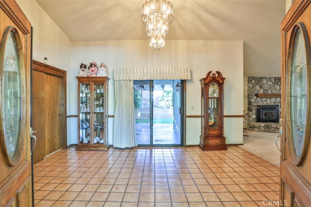 5848 Burlwood Court Rancho Cucamonga, CA 91701 - Photo 24 of 71 a view of empty room with window and chandelier
