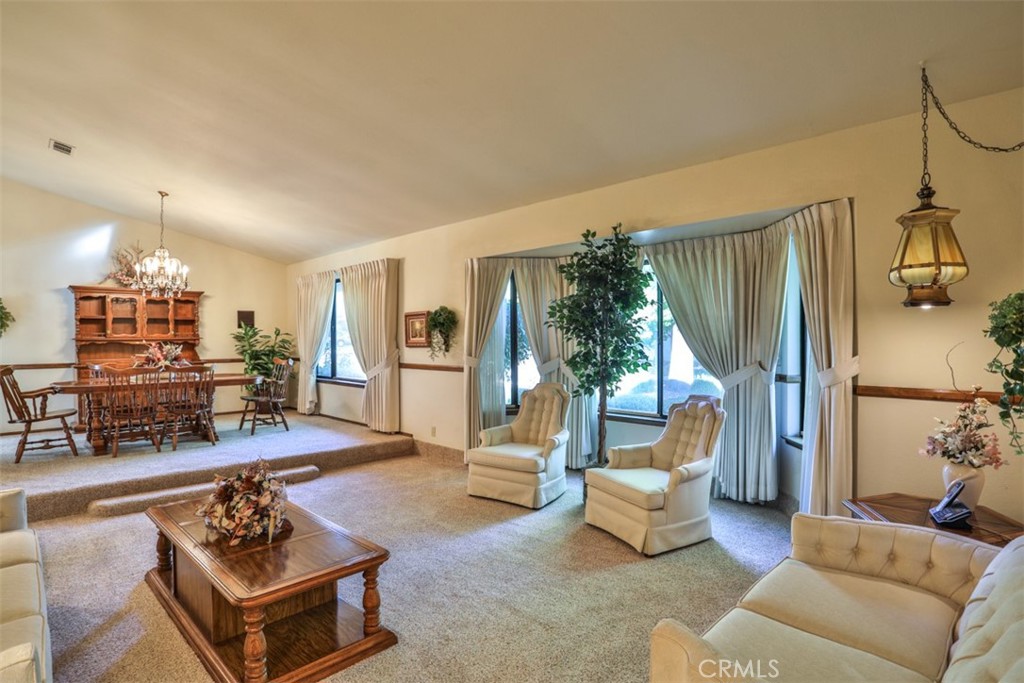 5848 Burlwood Court Rancho Cucamonga, CA 91701 - Photo 27 of 71 a living room with furniture and a table
