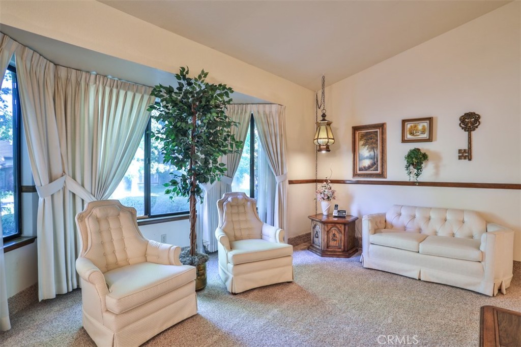 5848 Burlwood Court Rancho Cucamonga, CA 91701 - Photo 29 of 71 a living room with furniture and a large window