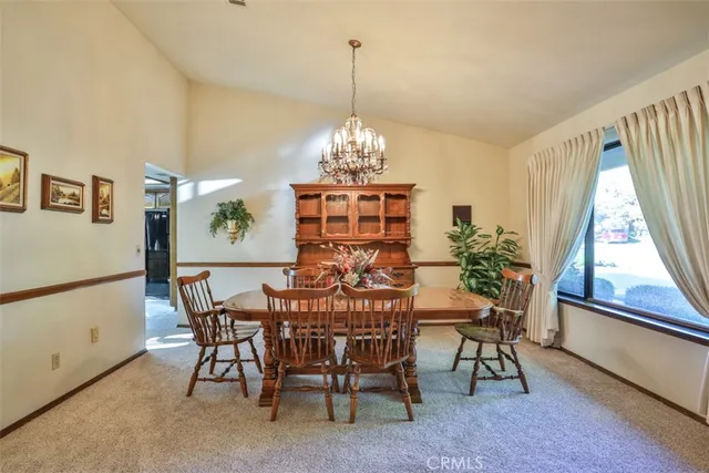 a kitchen with cabinets and chandelier
