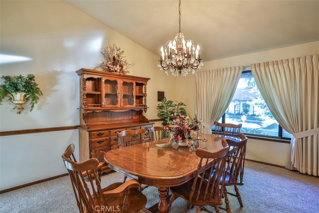 5848 Burlwood Court Rancho Cucamonga, CA 91701 - Photo 31 of 71 a view of a dining room with furniture window and wooden floor