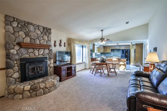 a bedroom with a large bed and a couch