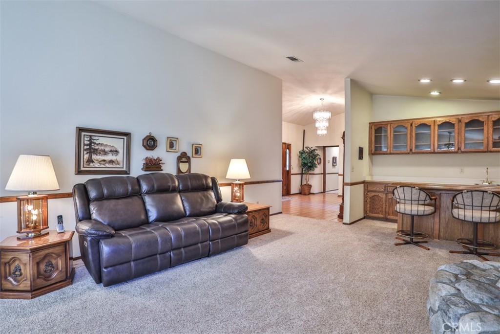 5848 Burlwood Court Rancho Cucamonga, CA 91701 - Photo 35 of 71 a living room with furniture and a lamp