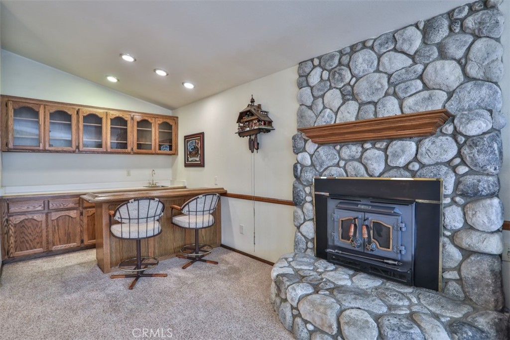 5848 Burlwood Court Rancho Cucamonga, CA 91701 - Photo 36 of 71 a living room with furniture and a fireplace