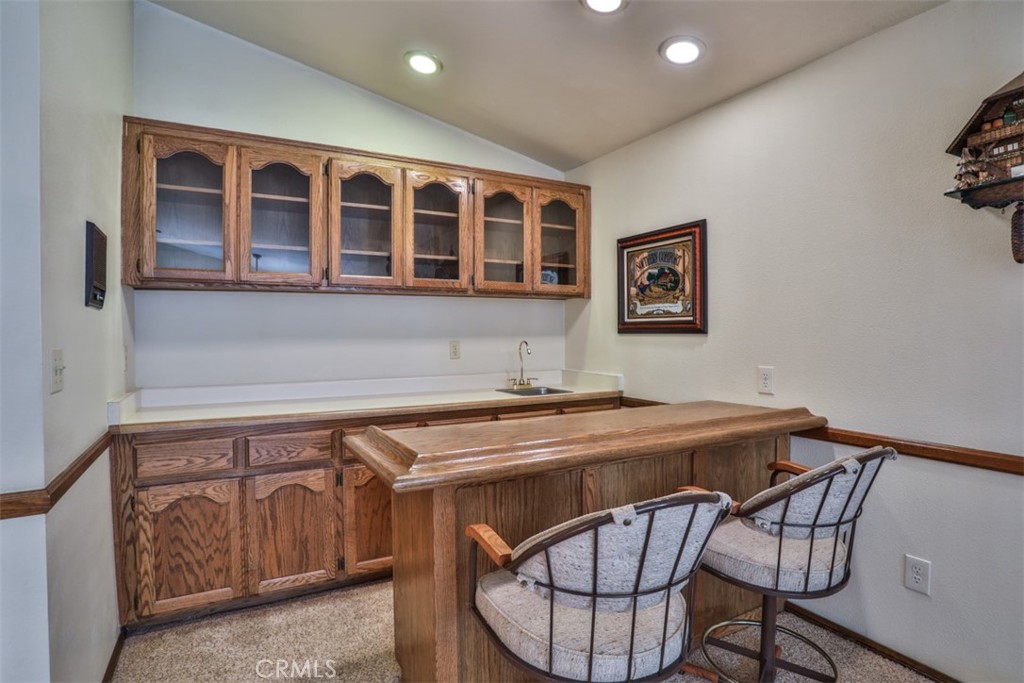 5848 Burlwood Court Rancho Cucamonga, CA 91701 - Photo 37 of 71 a utility room with a table and chairs