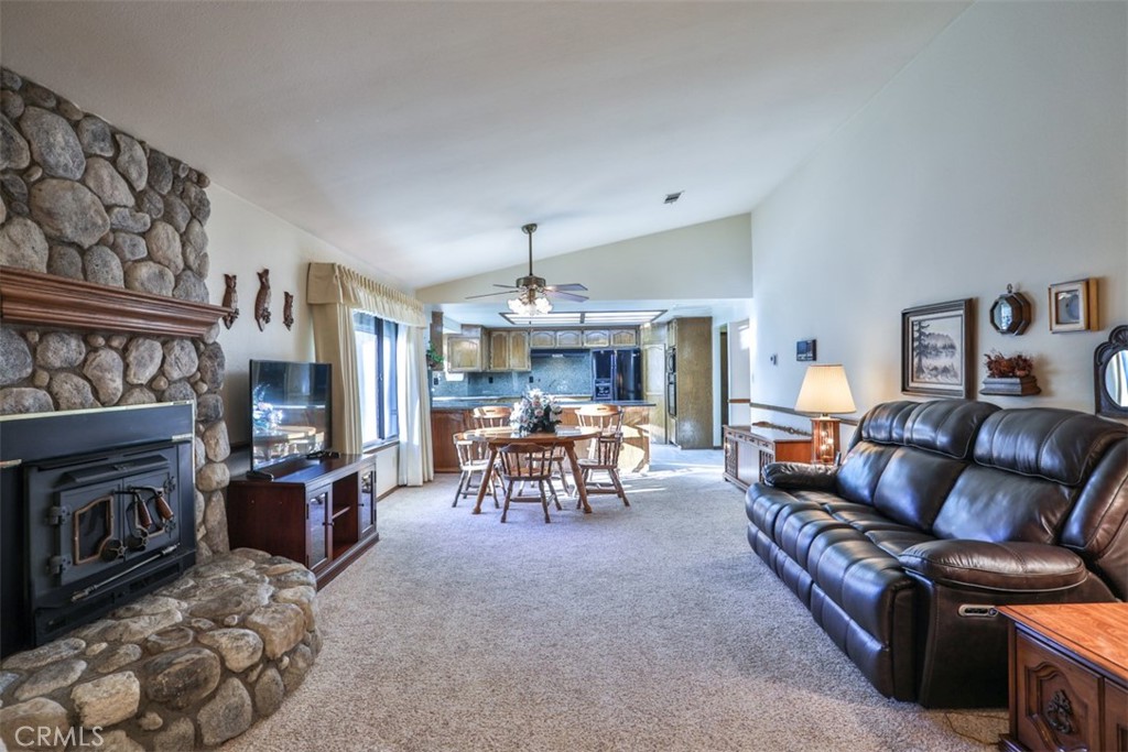 5848 Burlwood Court Rancho Cucamonga, CA 91701 - Photo 38 of 71 a living room with furniture and a fireplace