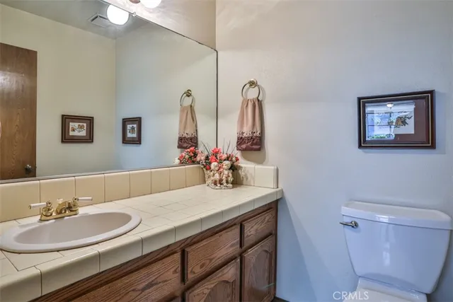 a bathroom with a sink a toilet and tub